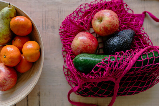 Eco friendly and reusable shopping mesh bag with fruits and vegetables