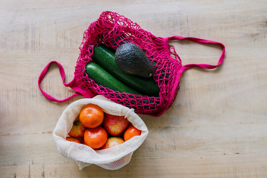 Eco friendly and reusable shopping mesh bag with fruits and vegetables