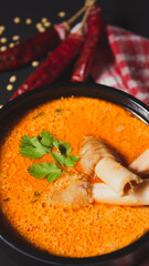 Closeup view of Indian style spicy Mutton or Lamb curry with spices, Portrait view, Flat lay