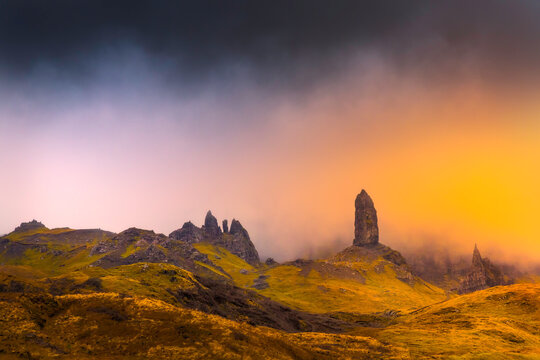Old man storr in isle of skye with magic orange light abstract feel
