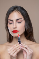 Serious woman with closed eyes with lipstick