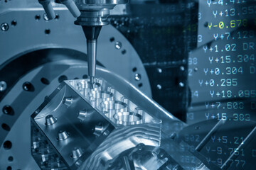 The abstract  scene of 5-axis machining center and G-code data background. The 5-axis milling machine cutting the aluminum cylinder block manufacturing process.