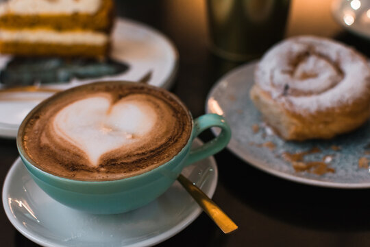 Coffee and pastries on a pub terrace. Close up image