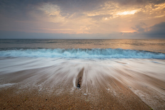 Waves at sunset at mediterranean sea.