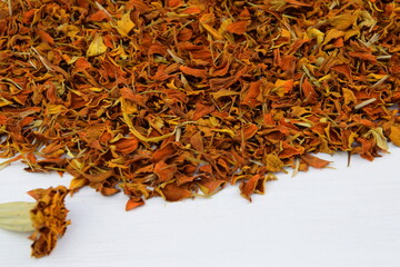 Tagetes patula dried petals, imeretian saffran, khmeli suneli ingredient, white background with space for text