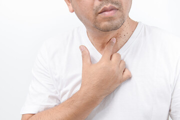 Fototapeta premium Man point to Skin Tags or Acrochordon on neck man on white background.