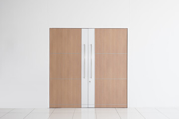 Modern wooden door and empty white wall , which ideal for use in the background design  put images and insert text