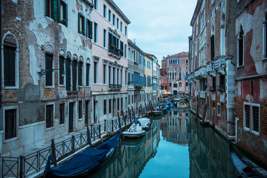 narrow canal in Venice after sunset