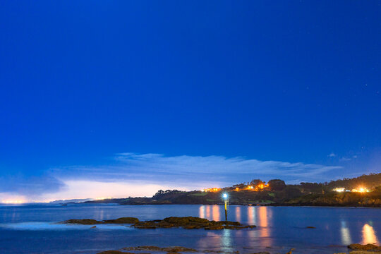 night photography on Luanco beach with the phallus illuminating the image