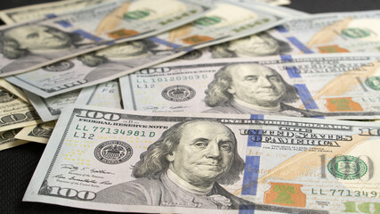 One hundred American dollar bills. dollars banknotes. 100 American dollars. Franklin. paper money, currency, cash. finance, payments. close-up