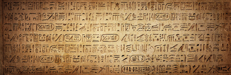 Old Egyptian hieroglyphs on an ancient background. Wide historical background. Ancient Egyptian...