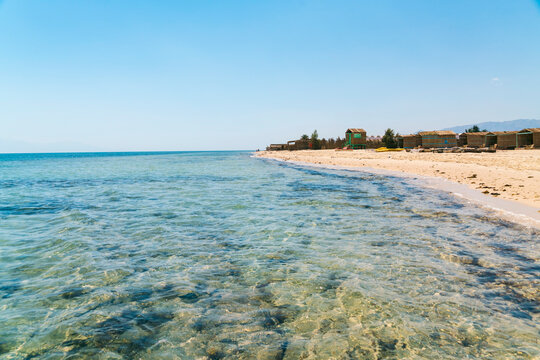 View of the Red Sea with clear water and bungalows