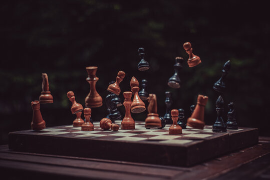 falling chess pieces on the chessboard