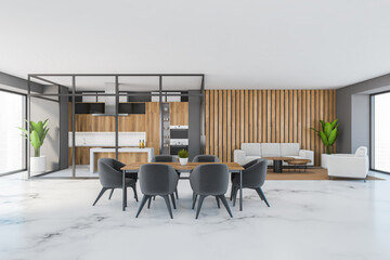 Big dining room with kitchen and sofa, eating table with chairs