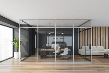 Wooden office consulting room behind glass doors near window