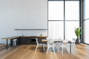 Modern kitchen interior with copy space on white brick wall, wooden countertops with a built in sink and a cooker. mock up. Loft apartment with dining area.