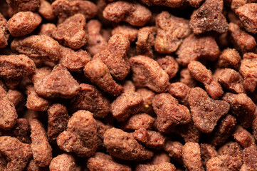 natural dry balanced food for cats in granules top view, close-up