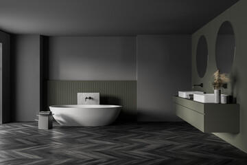 Fototapeta na wymiar Grey and green bathroom with white bathtub, mirrors and parquet floor