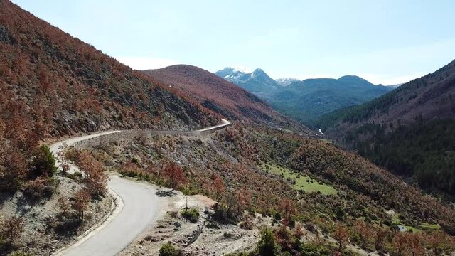Flight over a bendy mountain road in Albania