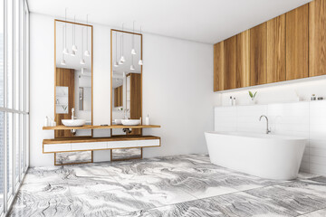 White and wooden bathroom with two sinks and bathtub on tiled marble floor