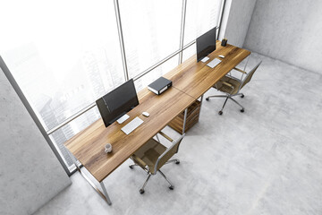 Top view of white business room with computers near window