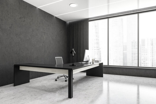 Grey office room with table and computer on marble floor
