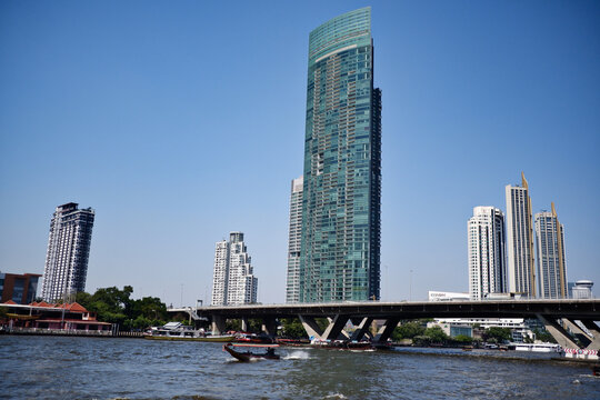 By the Chao Phraya river in Bangkok city - its banks and building around