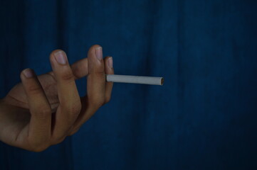 Hand holding cigarette