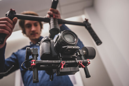 Videographer filming with gimbal and dslr