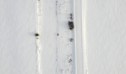 Top view of rural snowy road in winter