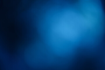 blue background with soft light flare bokeh