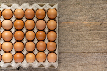 Chicken eggs in a carton. Flat lay.