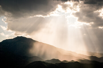 Sun Rays and Beams Reflected on Mountain Layers