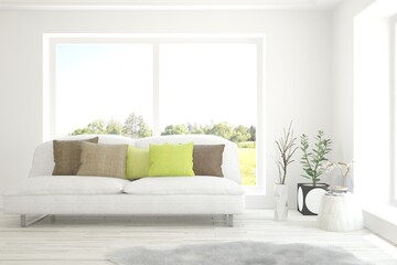 White living room with sofa and summer landscape in window. Scandinavian interior design. 3D illustration