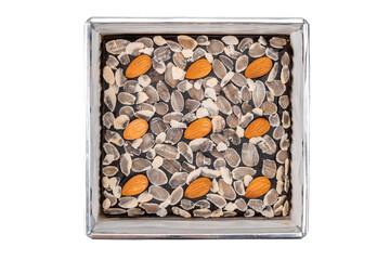 Top view of Dark chocolate brownie on topped by almond in a tray isolated on white background