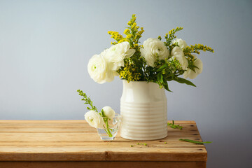 Beautiful spring flower bouquet on wooden table