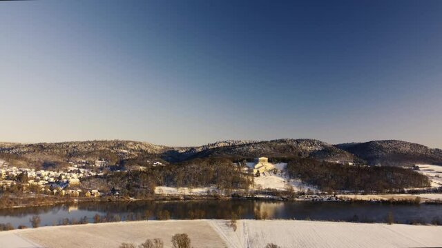 Drone view of historic landmark Walhalla in Donaustauf near Regensburg in Bavaria on danube river in beautiful winter landscape with snow on sunny day