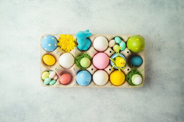 Easter holiday concept with Easter eggs decor on gray background
