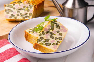 Vegetable pudding with green beans and ham.