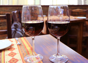 Pair of red wine on the wooden table