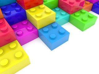 Colored toy bricks in the form of steps on white