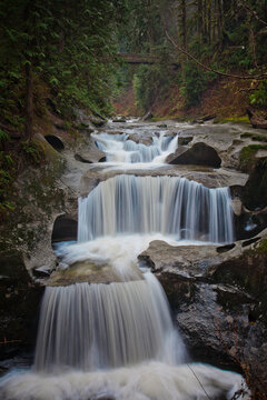 Scenic view of idyllic waterfall in forest