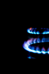 gas burner at night, blurred foreground and background with bokeh effect