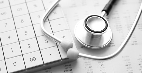 Stethoscope and calculator. Concept of health care costs or medical insurance