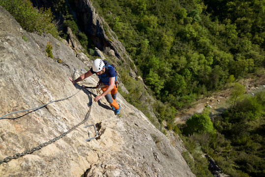 Climbing a ferrata route in Bierge in Guara Mountains.