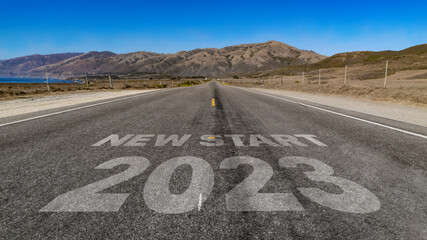 New Start 2023 written on highway road to the mountain