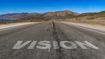 Vision written on highway road to the mountain