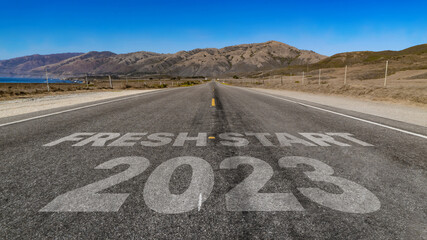 Fresh Start 2023 written on highway road to the mountain