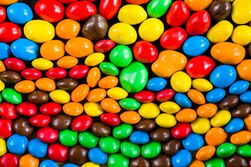 Fototapeta na wymiar M&M's candy background, colorful candy, multicolored gradient