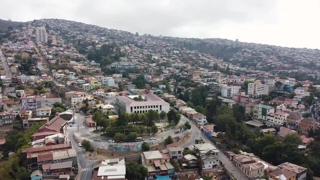 Aerial view from drone of Plaza Bismark, Avenida Alemania street and panoramic view of Cerro La Loma, Cerro Carcel and Cerro Miraflores. Residential development on hills of Valparaiso city, Chile